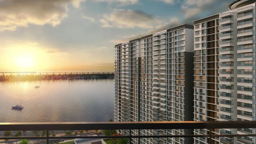 Marina One Kochi tower facade at sunset overlooking the waterfront
